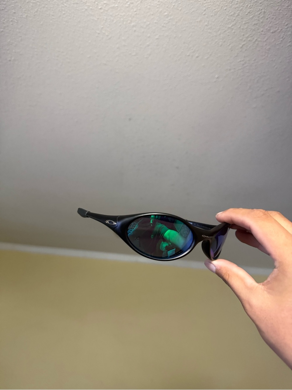 Oakley Black Frame Sunglasses with Green Mirrored Lenses